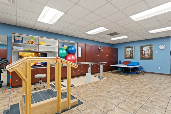Rehabilitation gym with equipment and therapy space