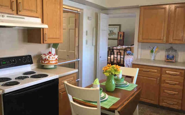 Cozy kitchen and dining area in a senior living apartment