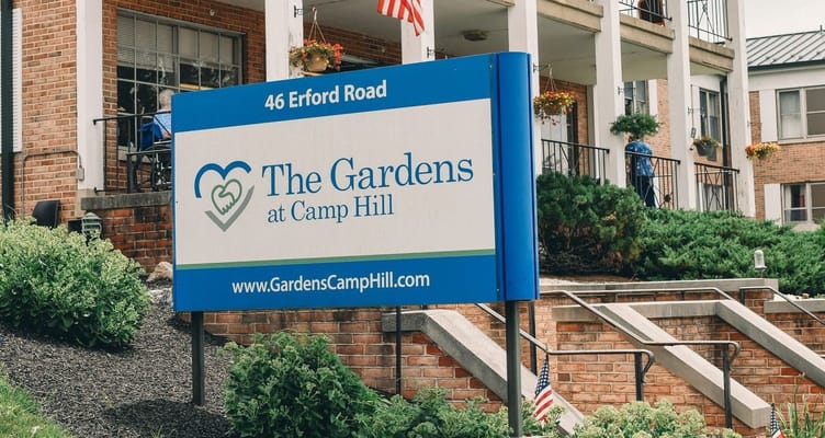 Exterior view of The Gardens at Camp Hill sign