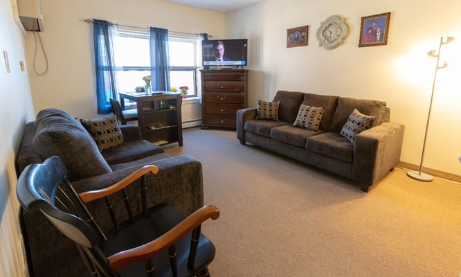 Cozy living room area with furniture and TV