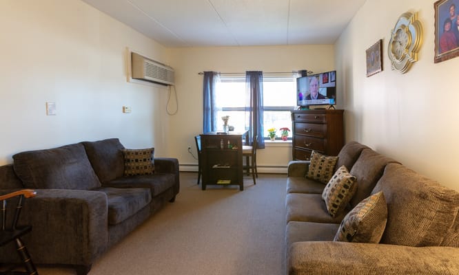 Cozy living room setup with seating and TV