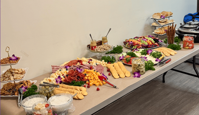 A beautifully arranged buffet with assorted foods and snacks