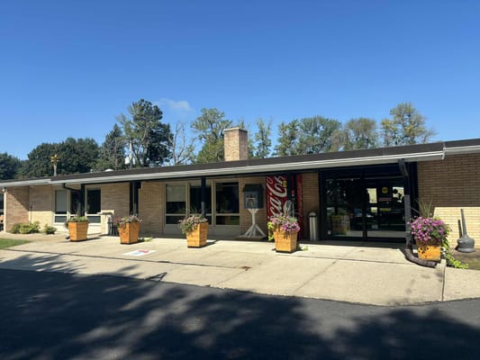 Exterior view of Tuff Memorial Home with flower pots