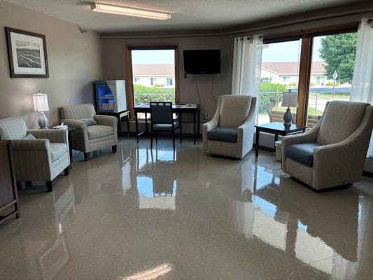 Bright common area with seating and windows