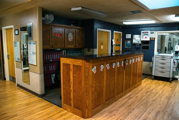 Interior reception area with wooden counter and decor