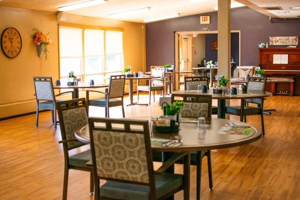 Bright dining room with tables and plants
