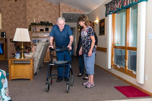 Residents and staff interacting in a common area