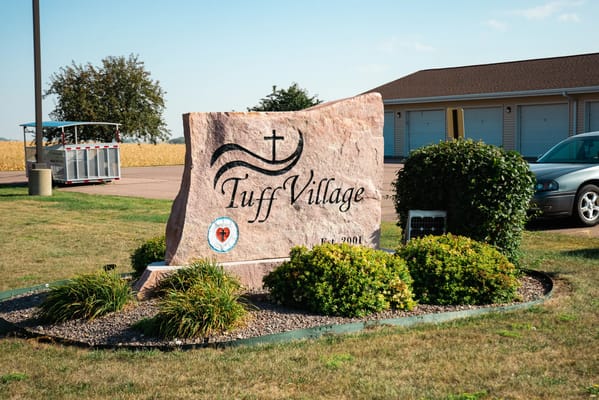Entrance sign for Tuff Village assisted living facility