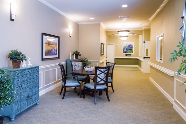 Interior hallway with seating area and artwork