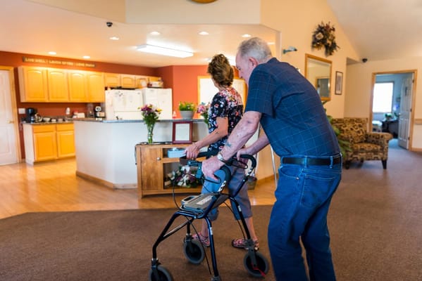 Residents walking in a common area of the facility