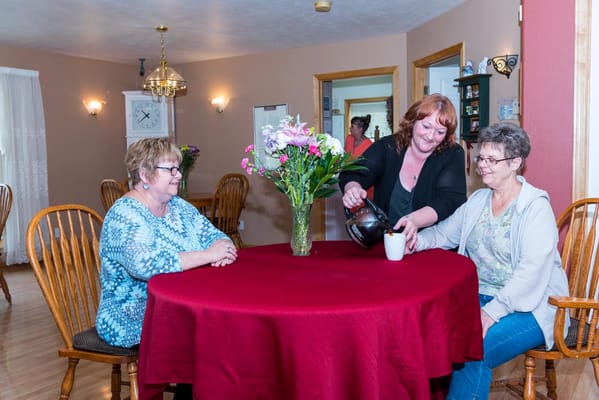 Residents enjoying coffee together in a common area