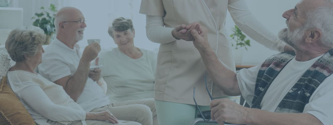 Residents and staff interacting in a cozy common area