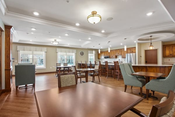 Interior view of a common area with dining tables and chairs