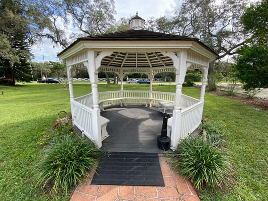 A gazebo in a well-maintained garden area