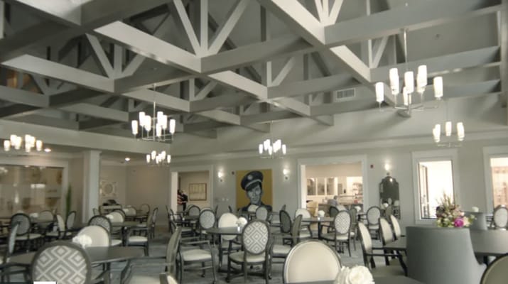 Bright and spacious common area with dining tables