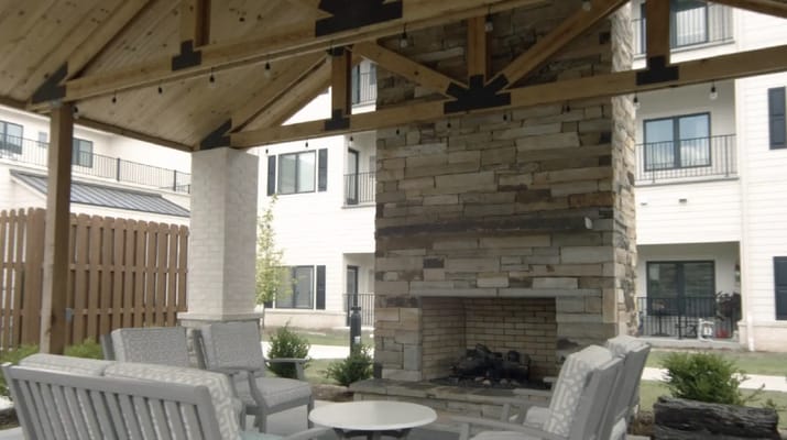 Outdoor seating area with a fireplace