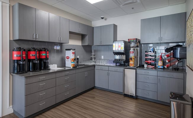 Well-equipped coffee station in a common area kitchen