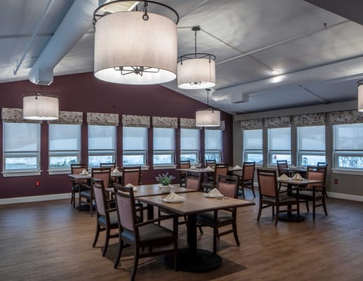 Bright dining room with modern lighting and tables