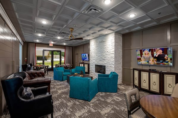 Interior common area with seating and TV