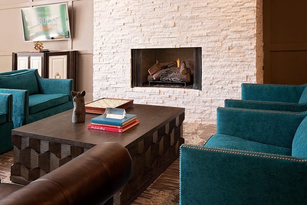 Cozy common area with seating and a fireplace