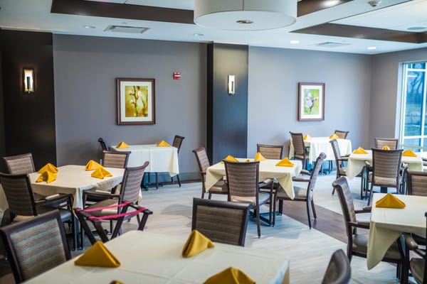 Dining area with tables set for a meal