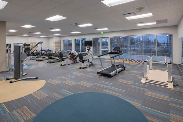 A modern fitness room with exercise equipment