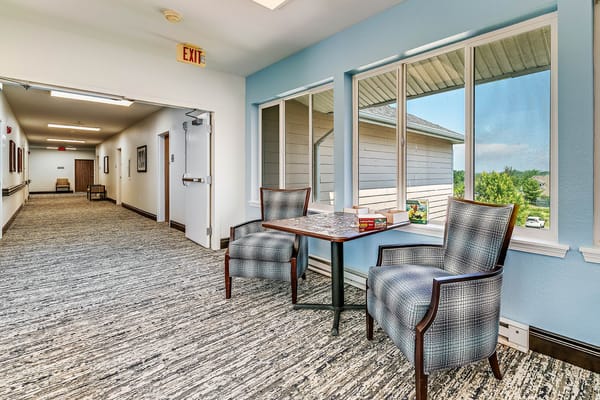 Bright interior area with seating and large windows