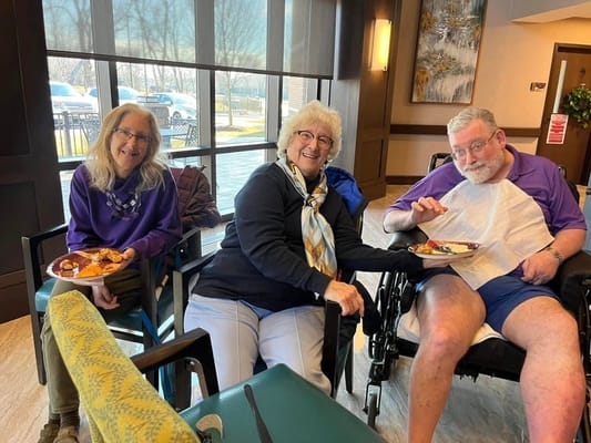Residents enjoying a meal in a common area