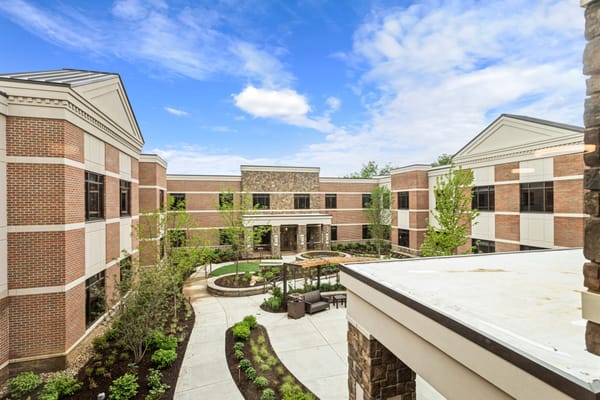 View of a courtyard area with gardens and seating