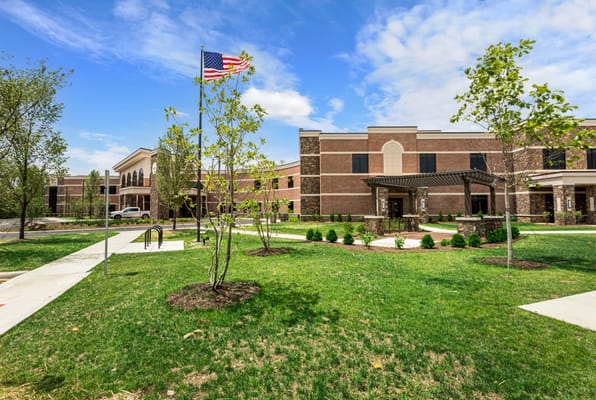 Exterior view of assisted living facility with landscaping