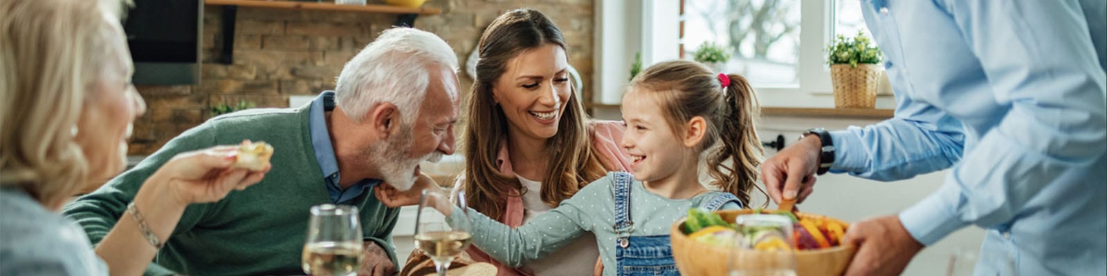 Family gathering in a cozy dining area with food