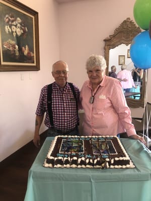 Residents celebrating a birthday with a cake