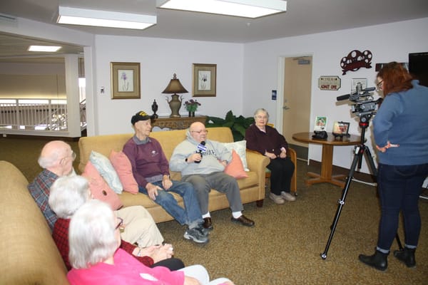Residents enjoying a group interview in a common area