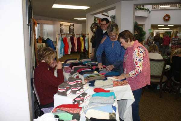 Residents participating in a crafting activity in a common area