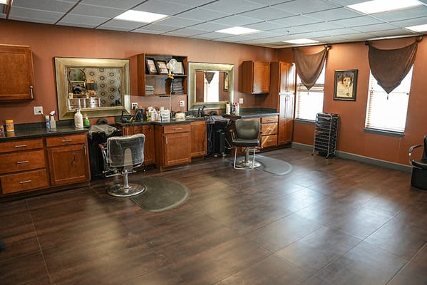 Interior view of a salon with styling chairs and mirrors