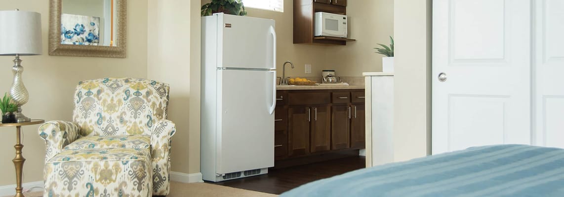 Cozy interior of a resident's room with kitchenette