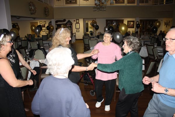 Residents enjoying a dance event in the common area