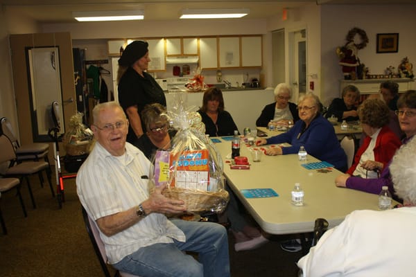 Residents participating in a bingo game at a common area