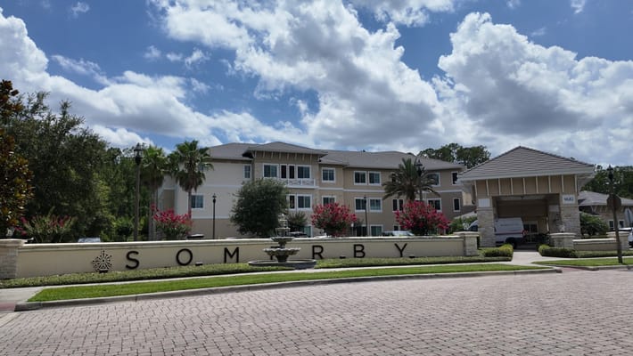 Exterior view of Somerby facility with landscaped entrance