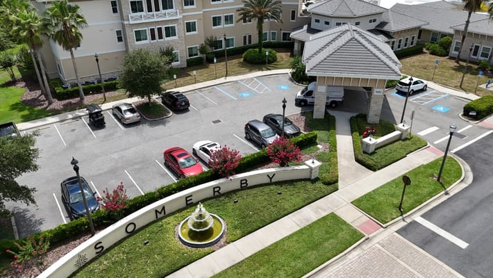 Aerial view of the entrance and parking area of Somerby Lake Nona