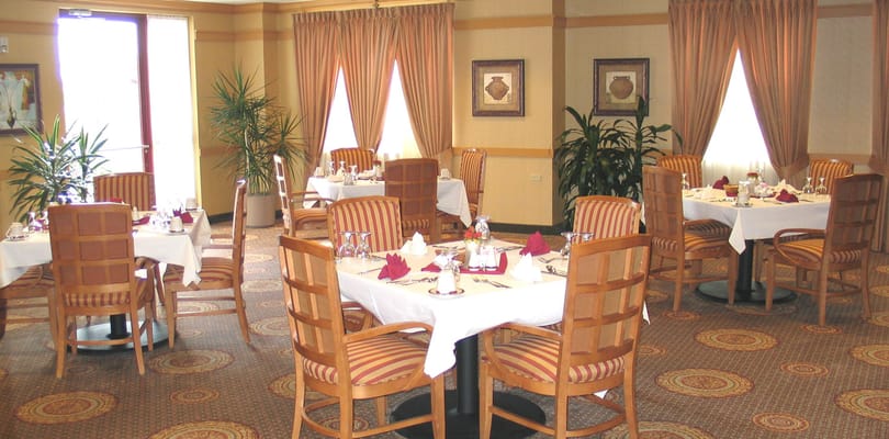 Dining area with tables and decorated settings