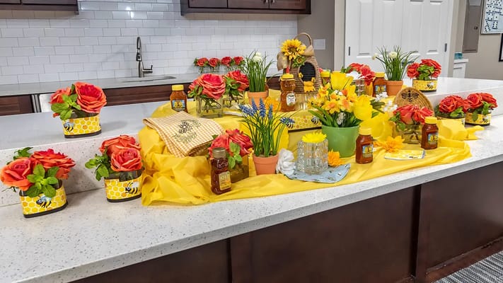 Decorative kitchen table with flowers and honey jars