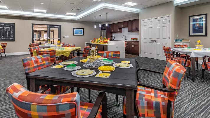 Bright dining room with colorful chairs and tables