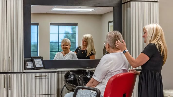 Residents enjoying a salon experience in a vibrant interior