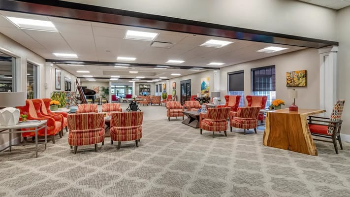 Bright common area with comfortable seating for residents