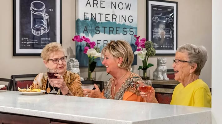 Residents enjoying drinks and engaging in conversation