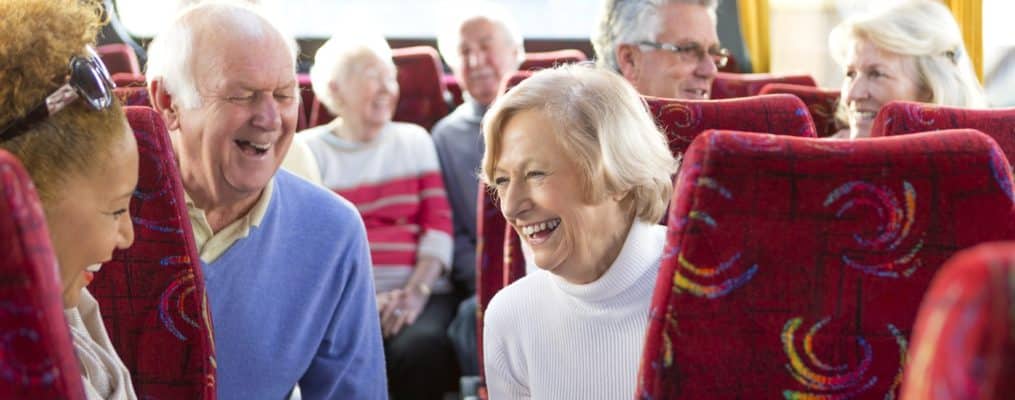 Residents enjoying laughter on a transport bus