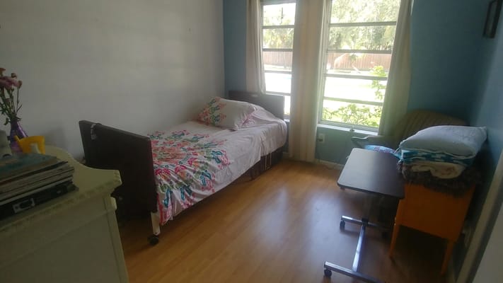 Private resident room with bed and window