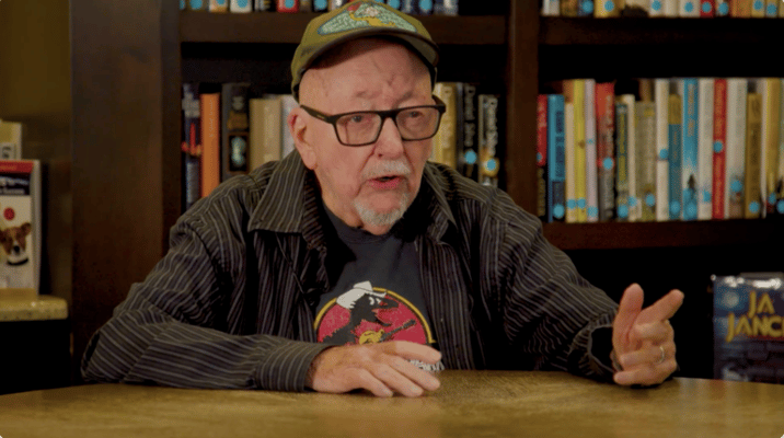 Elderly man discussing in a cozy library space