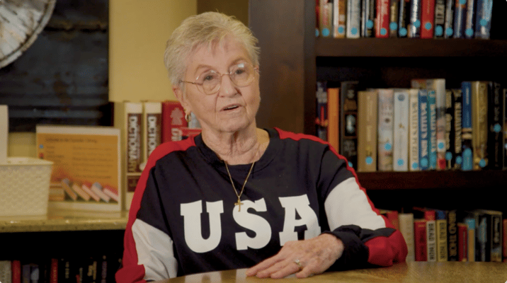 Senior resident engaging in conversation indoors